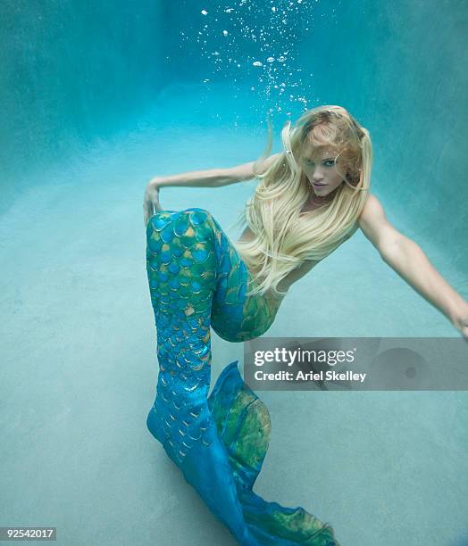 mermaid swimming under water - fantasy mermaid stock pictures, royalty-free photos & images