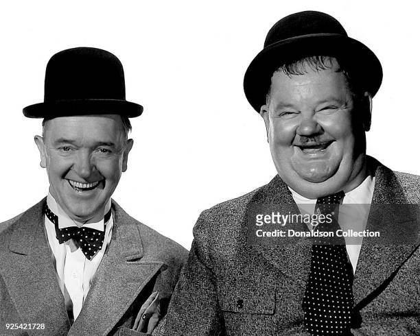 Comic actors Stan laurel and Oliver Hardy pose for a portrait circa 1935 in Los Angeles, California.