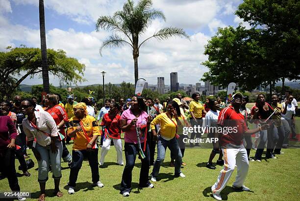 Supporters of South African football team Bafana Bafana are dancing the Diski dance on October 30,2009 at the Union Buildings in Pretoria during a...