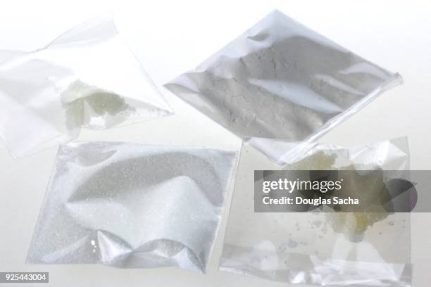 individual bags of illegal drugs on a white background - crack cocaine stock pictures, royalty-free photos & images