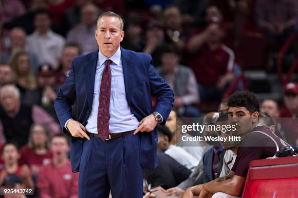 Head Coach Billy Kennedy of the Texas A&M Aggies watches his player during a game against the Arkansas Razorbacks at Bud Walton Arena on February 17,...