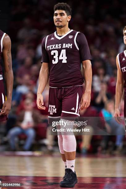 Tyler Davis of the Texas A&M Aggies standing at mid court during a game against the Arkansas Razorbacks at Bud Walton Arena on February 17, 2018 in...