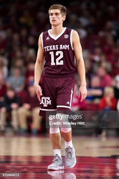 Chris Collins of the Texas A&M Aggies standing at mid court during a game against the Arkansas Razorbacks at Bud Walton Arena on February 17, 2018 in...