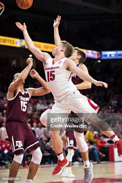 Jonathan Holmes of the Arkansas Razorbacks drives to the basket during a game against the Texas A&M Aggies at Bud Walton Arena on February 17, 2018...