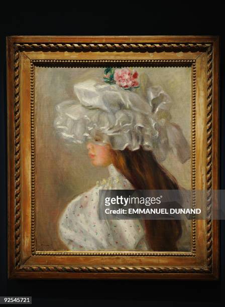 "Femme au Chapeau Blanc" by Pierre-Auguste Renoir is on display during a preview of Sotheby's impressionist and modern art sale in New York, October...