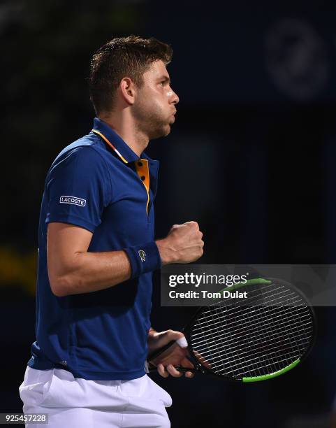 Filip Krajinovic of Serbia celebrates a point during his match against Marcos Baghdatis of Cyprus on day three of the ATP Dubai Duty Free Tennis...