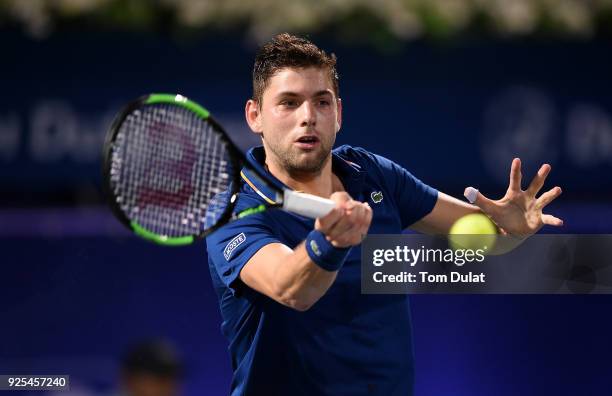 Filip Krajinovic of Serbia plays a forehand during his match against Marcos Baghdatis of Cyprus on day three of the ATP Dubai Duty Free Tennis...