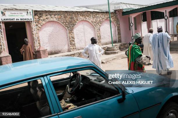 Advisers to the Lamido of Mokolo, the traditionnal leader, walk by the Lamido's office on February 17 Far-North Region, Cameroon. Since 2014, the Far...