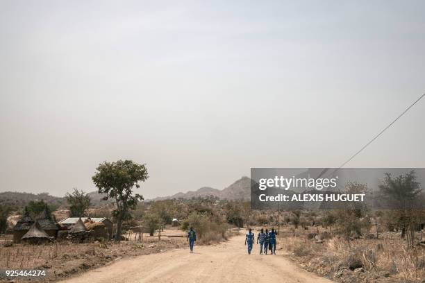 High school students walk on the road to Koza on the outskirts of Mokolo on February 20 Far-North Region, Cameroon. Since 2014, the Far North region...