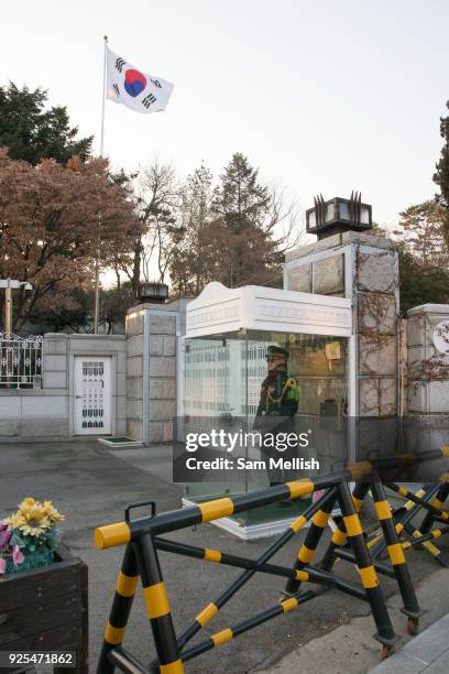 Security guard in a glass cabin in the Sogyeok-Dong area of Seoul city on 26th February 2018 in South Korea