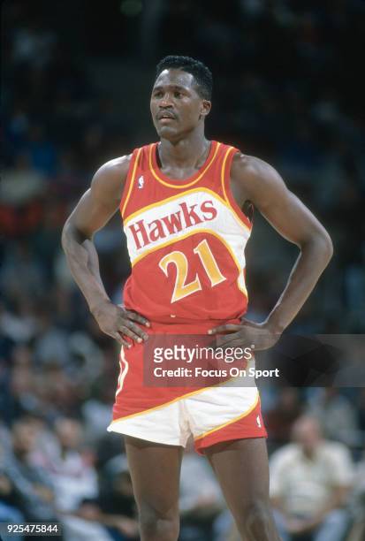 Dominique Wilkins of the Atlanta Hawks looks on against the Milwaukee Bucks during an NBA basketball game circa 1989 at the Bradley Center in...