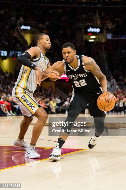 Rodney Hood of the Cleveland Cavaliers guards Rudy Gay of the San Antonio Spurs during the second half at Quicken Loans Arena on February 25, 2018 in...