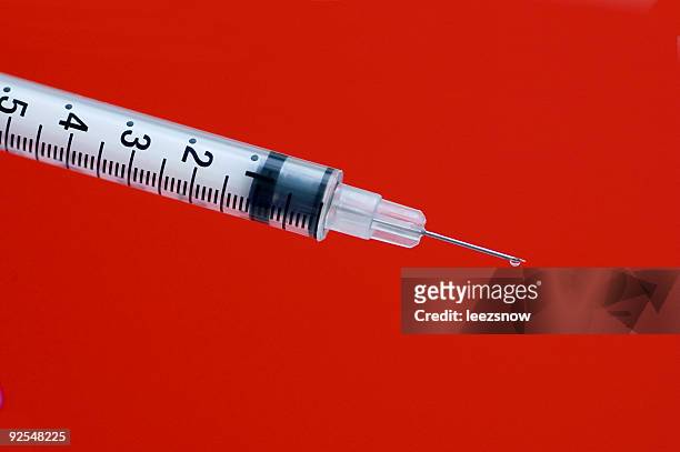 syringe on red - 2 - phobia stock pictures, royalty-free photos & images