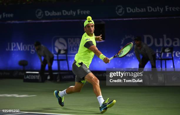 Malek Jaziri of Tunisia plays a backhand during his match against Robin Haase of Netherlands on day three of the ATP Dubai Duty Free Tennis...