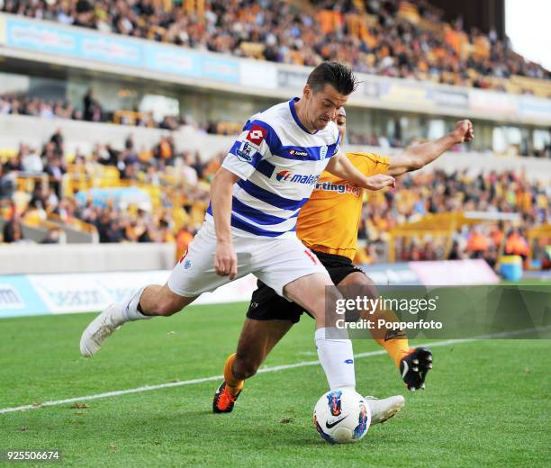 Joey Barton of Queens Park Rangers and Karl Henry of Wolves battle for the ball during the Barclays Premier League match between Wolverhampton...