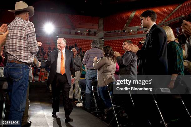 Billionaire hedge-fund manager T. Boone Pickens, center, arrives for a town hall meeting at Oklahoma State University's Gallagher-Iba Arena in...