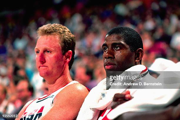 Larry Bird and Magic Johnson of the USA Men's Basketball team sit on the bench during the game at the Rose Garden in 1992 in Portland, Oregon. NOTE...