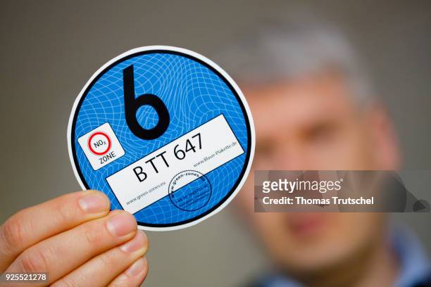 Berlin, Germany A blue badge to regulate diesel driving bans are held in the camera on February 28, 2018 in Berlin, Germany.