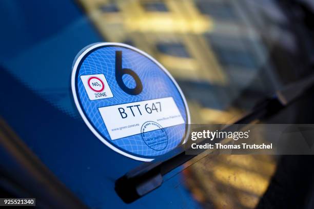 Berlin, Germany A blue badge to regulate diesel driving bans stucks in the windshield of a car on February 28, 2018 in Berlin, Germany.