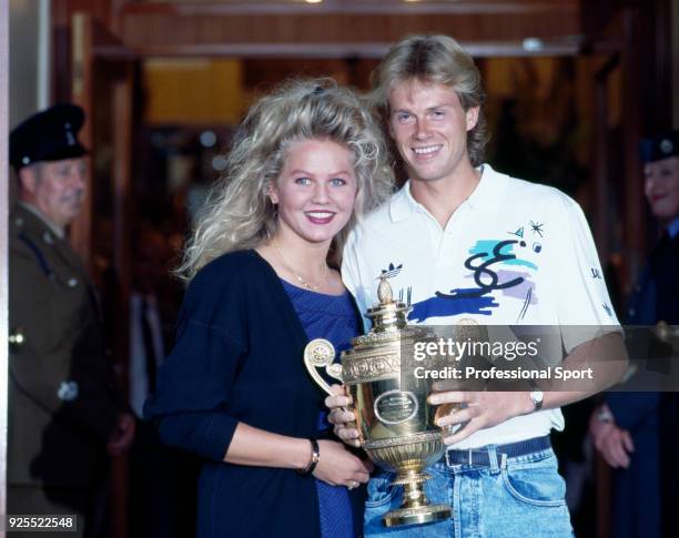 Stefan Edberg of Sweden poses with his girlfriend Annette Olsen after defeating Boris Becker of West Germany in the Men's Singles Final of the...