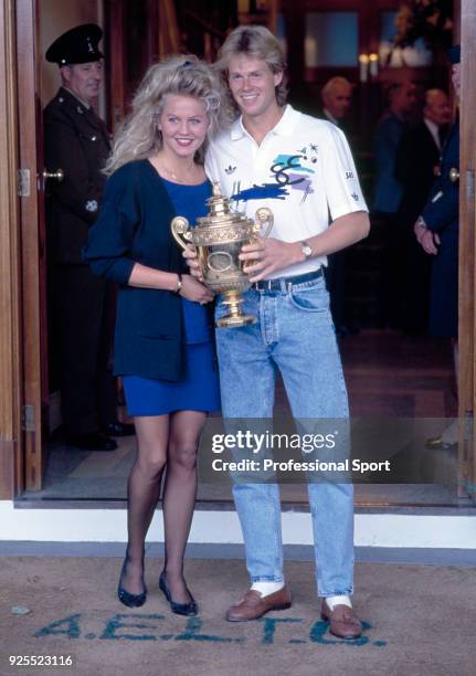 Stefan Edberg of Sweden poses with his girlfriend Annette Olsen after defeating Boris Becker of West Germany in the Men's Singles Final of the...