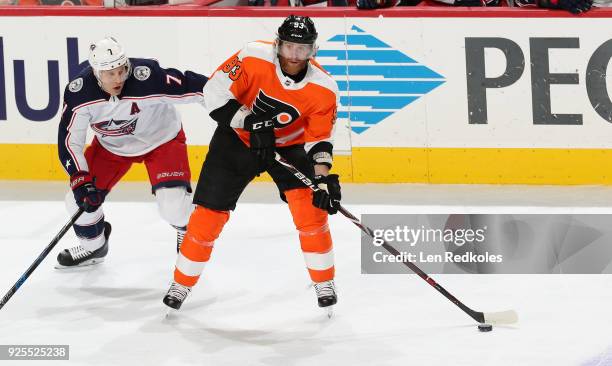 Jakub Voracek of the Philadelphia Flyers skates the puck against Jack Johnson of the Columbus Blue Jackets on February 22, 2018 at the Wells Fargo...