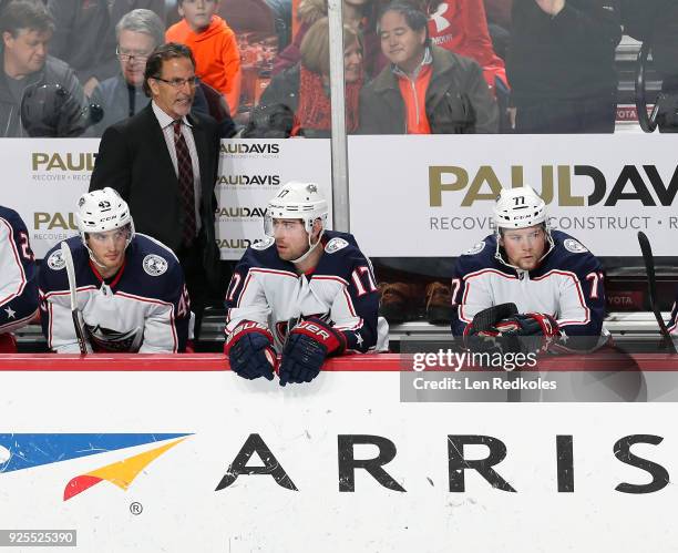 Head Coach John Tortorella of the Columbus Blue Jackets reacts to the play on the ice behind Lukas Sedlak, Brandon Dubinsky and Josh Anderson against...