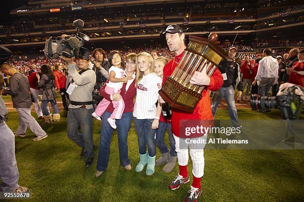 Playoffs: Philadelphia Phillies Jamie Moyer victorious with family holding National League Championship trophy after winning Game 5 vs Los Angeles...