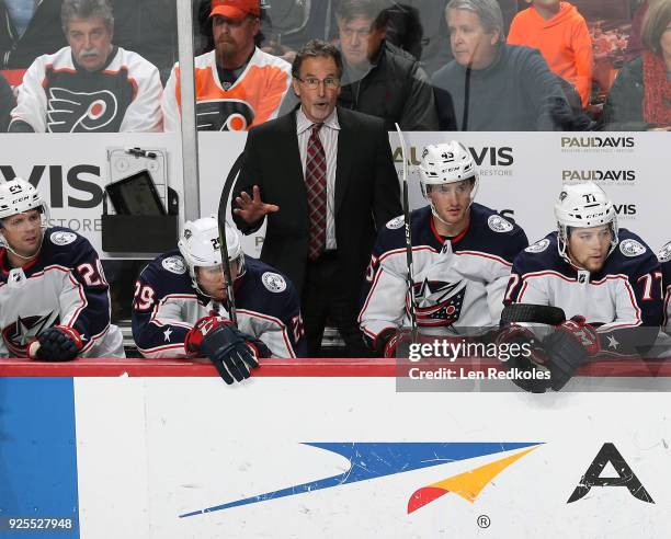 Head Coach John Tortorella of the Columbus Blue Jackets reacts to the play on the ice behind Nathan Gerbe, Zac Dalpe, Lukas Sedlak and Josh Anderson...