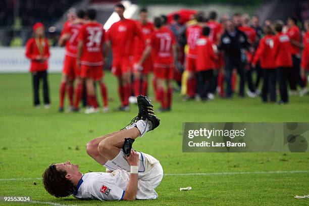 Matthias Langkamp of Karlsruhe lies dejected on the pitch after loosing the Second Bundesliga match between Fortuna Duesseldorf and Karlsruher SC at...