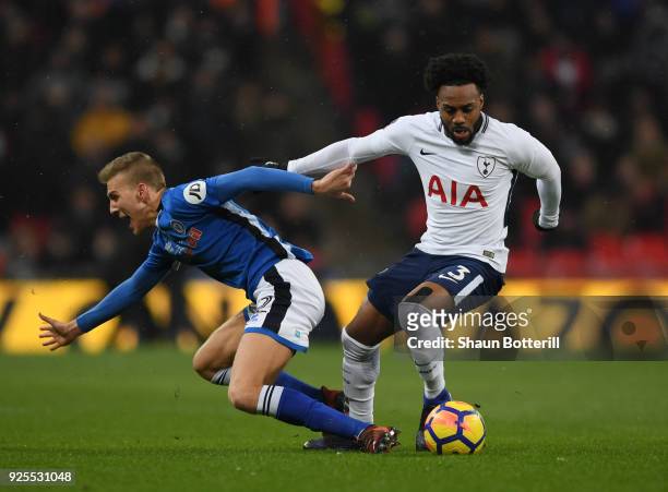Danny Rose of Tottenham Hotspur skips past Joseph Rafferty of Rochdale during the Emirates FA Cup Fifth Round Replay match between Tottenham Hotspur...