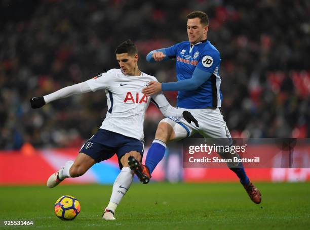 Eric Lamela of Tottenham Hotspur holds off Harrison McGahey of Rochdale during the Emirates FA Cup Fifth Round Replay match between Tottenham Hotspur...