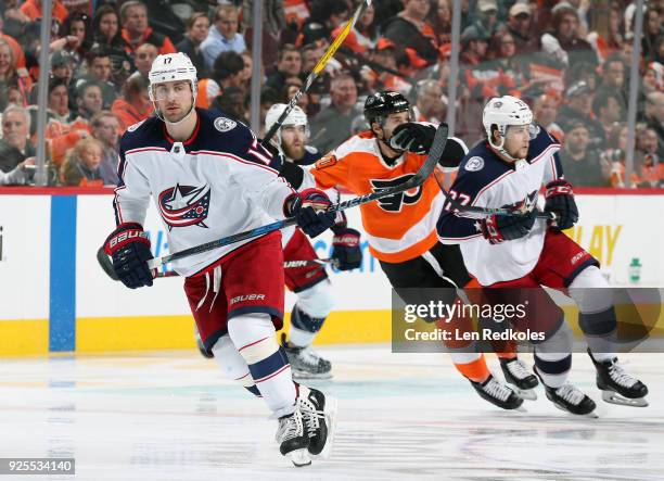 Brandon Dubinsky and Josh Anderson of the Columbus Blue Jackets skate against Taylor Leier of the Philadelphia Flyers on February 22, 2018 at the...