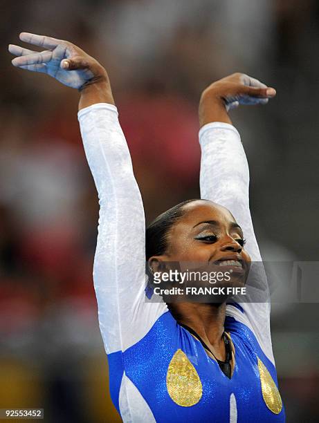 File photo of Brazil's Daiane Dos Santos while she competes on the floor during the women's team final of the artistic gymnastics event of the...