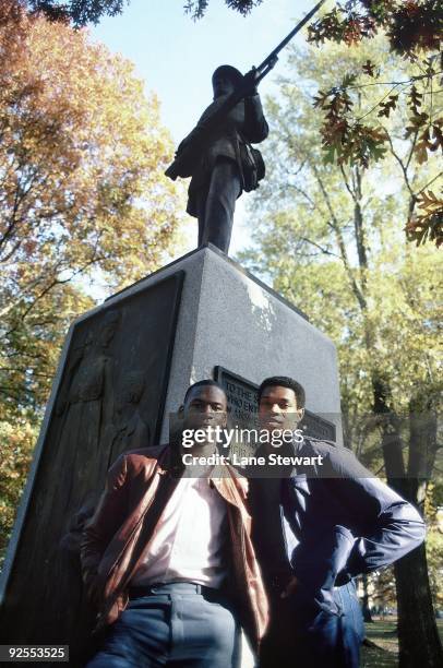 North Carolina Michael Jordan and Sam Perkins posing by Silent Sam statue on UNC campus. Chapel Hill, NC CREDIT: Lane Stewart