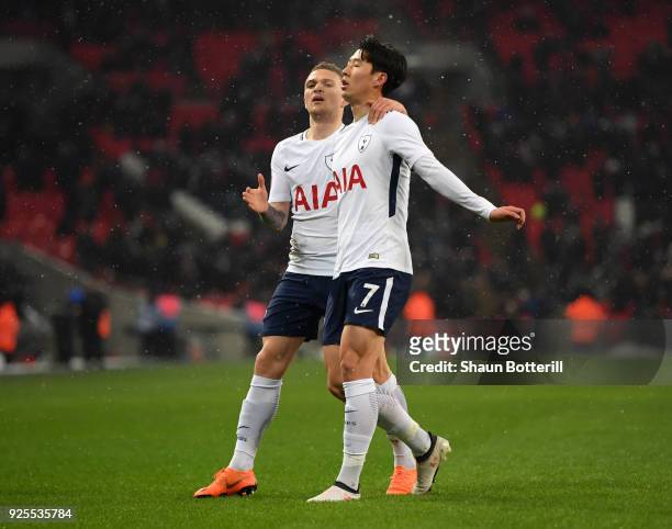 Heung-Min Son of Tottenham Hotspur celebrates scoring the opening goal with Kieran Trippier during the Emirates FA Cup Fifth Round Replay match...