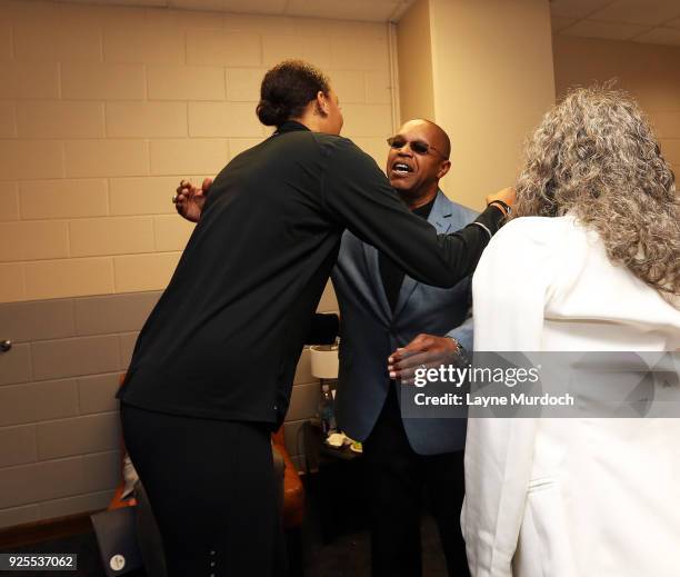 The WNBA Dallas Wings Australian professional basketball player Elizabeth "Liz" Cambage hugs Wings head coach Fred Williams before a press conference...