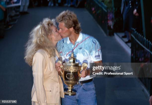 Stefan Edberg of Sweden kissing his girlfriend Annette Olsen after defeating Boris Becker of West Germany in the Men's Singles Final of the Wimbledon...