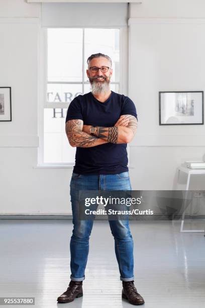 portrait of smiling muscular caucasian hipster man - man portrait full body stock-fotos und bilder