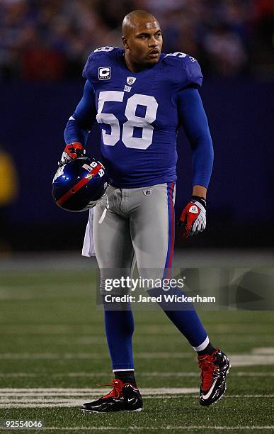 Antonio Pierce of the New York Giants walks onto the field against the Arizona Cardinals on October 25, 2009 at Giants Stadium in East Rutherford,...