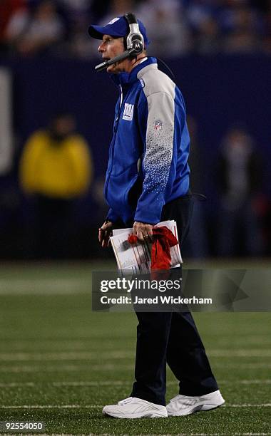 Head coach Tom Coughlin of the New York Giants talks with referees during the first half against the Arizona Cardinals on October 25, 2009 at Giants...