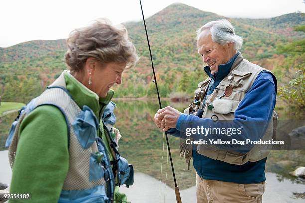 boomer couple fly fishing - manchester vermont stock-fotos und bilder