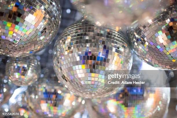 disco balls on ceiling - disco ball stock pictures, royalty-free photos & images