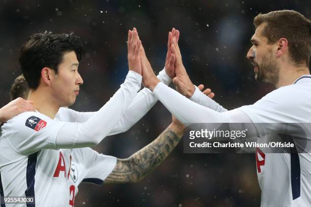 Son Heung-min celebrates with Fernando Llorente of Tottenham Hotspur during the Emirates FA Cup Fifth Round Replay match between Tottenham Hotspur...