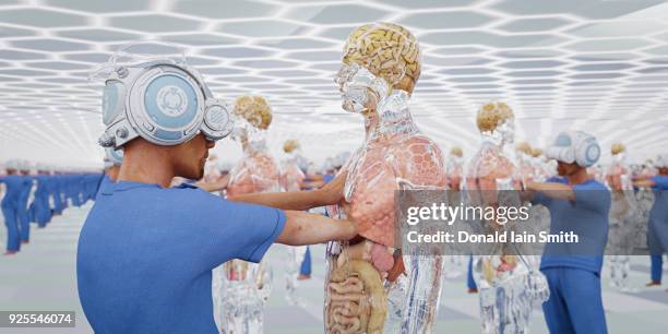 doctors wearing virtual reality goggles examining transparent men - centro cirurgico imagens e fotografias de stock