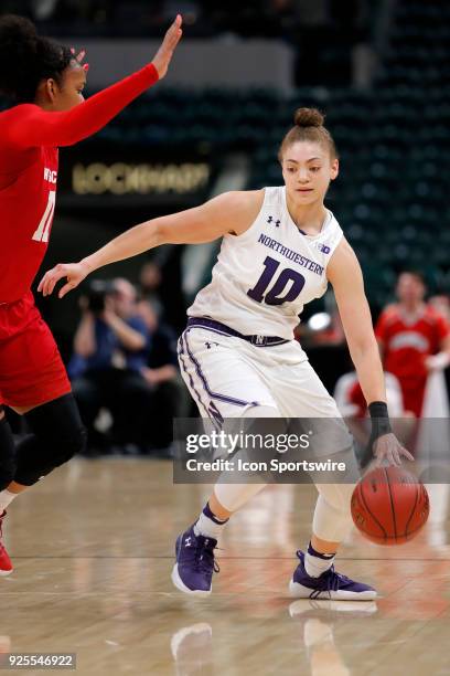 Northwestern Wildcats guard Lindsey Pulliam looks to drive around Wisconsin Badgers forward Marsha Howard during the game between the Wisconsin...