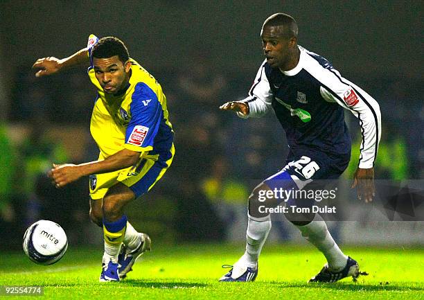 Francis Laurent of Southend United and Andy Barcham of Gillingham chase the ball during the Coca-Cola Football League One match between Southend...