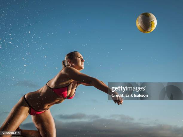 caucasian woman diving to volleyball - womens beach volleyball foto e immagini stock