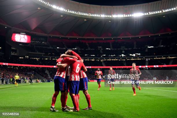Atletico players celebrate their opening goal during the Spanish league football match Club Atletico de Madrid against Club Deportivo Leganes SAD at...