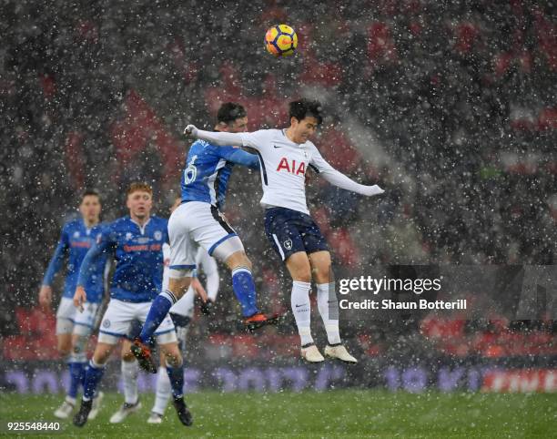 Heung-Min Son of Tottenham Hotspur rises for the ball under pressure from Harrison McGahey of Rochdale during the Emirates FA Cup Fifth Round Replay...